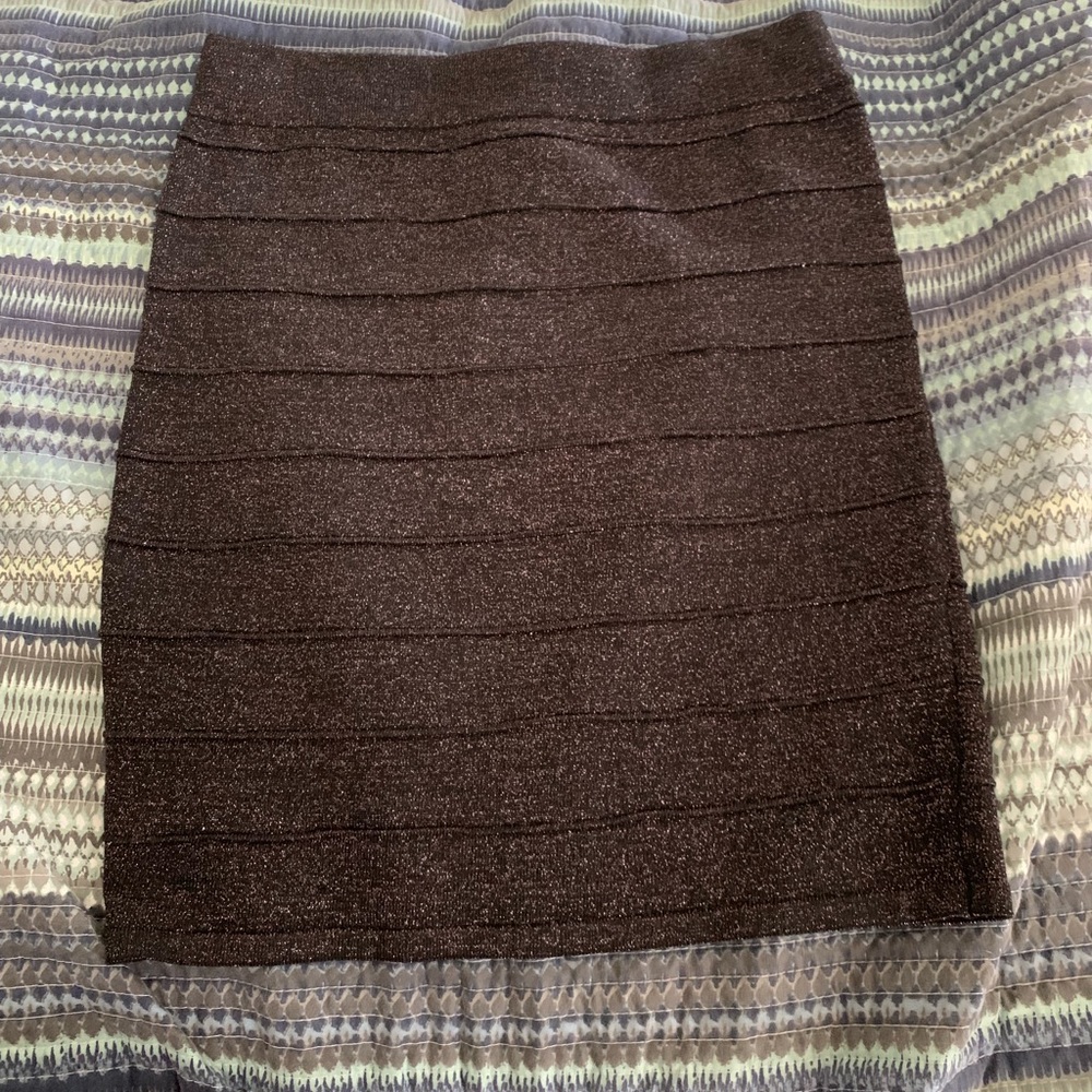 Black sparkly skirt, runs a little small.
